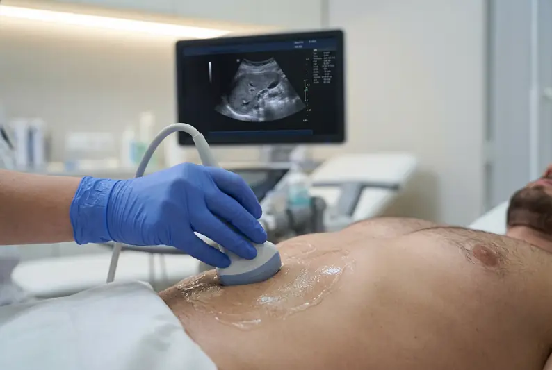 Sonographer performing abdominal ultrasound-scan on male patient at Sonoworld Marylebone
