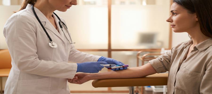 Healthcare professional drawing a blood sample at Sonoworld's Marylebone clinic